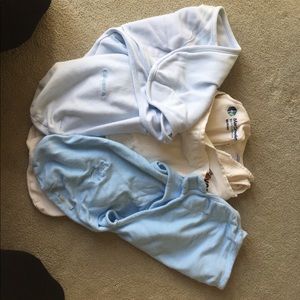 Three cotton newborn-sized sleep sacks